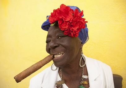 A woman smoking a cigar.